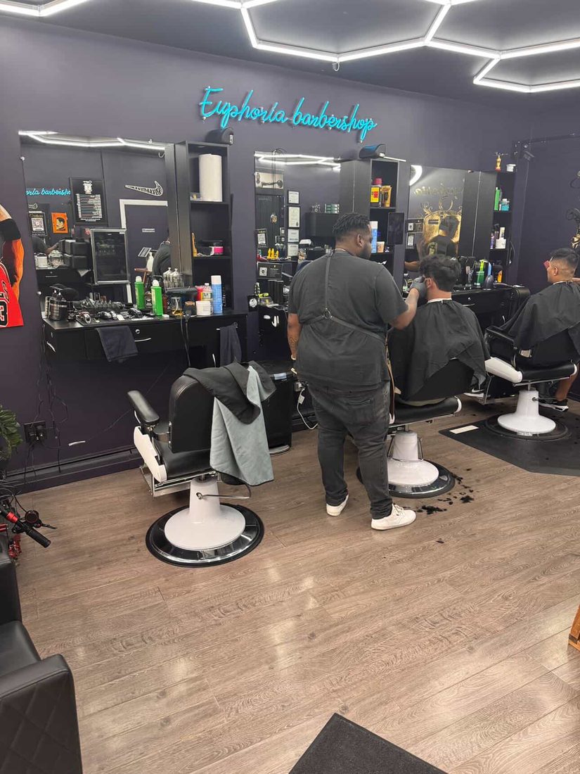 Inside Euphoria Barbershop — wide interior view